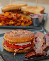 Whiskey Kitchen signature dishes WK Chicken & Waffles The "Kitchen" Brunch BurgerFire Roasted Salmon